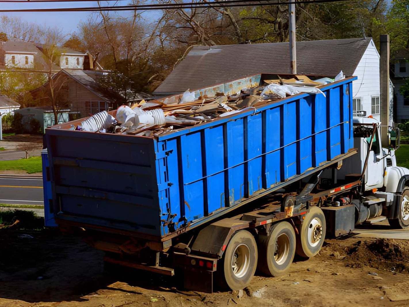 Placeholder: Junk Hunk truck parked outside a home